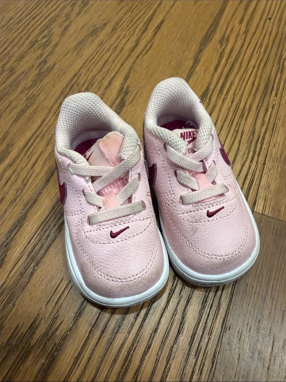 Nike Baby Pink Sneakers with Maroon Swoosh Accents